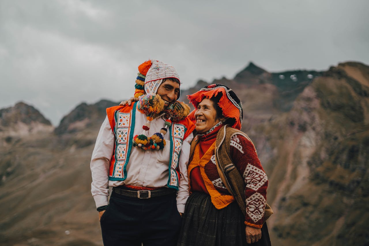 Man and Woman in Traditional Clothing Looking at Each Other and Smiling